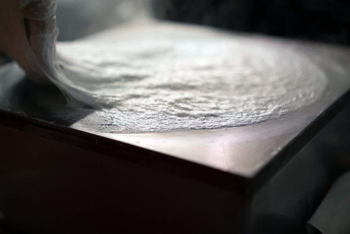 Popiah skin being made by hand